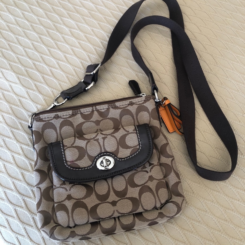 Brown and tan coach crossover bag.